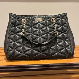 Shiny black quilted-look bag